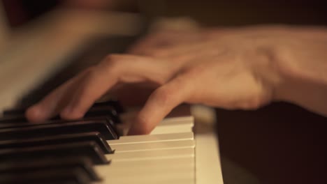 Close-up-shot-of-professional-musician-hands-playing-keyboard-piano