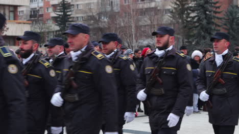 Soldiers-carrying-rifles-march-in-National-Day-Parade,-Miercurea-Ciuc,-Romania