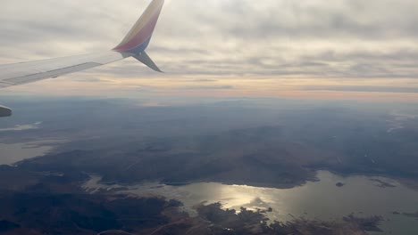 Southwest-Plane-Flying-Above-Lake-in-Nevada