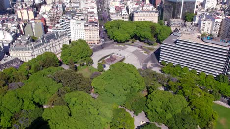 Aerial-view-of-the-square-and-statue-of-General-San-Martin-and-a-large-park-in-Retiro,-Buenos-Aires