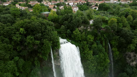 Drone-Flying-Towards-The-Foamy-Cascades-Of-Marmore-Falls,-Cascata-Delle-Marmore-In-Umbria-Region,-Italy