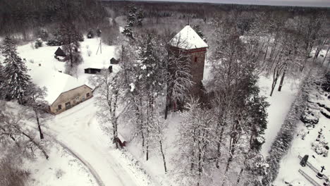 Old-stone-church-in-Latvian-country-side,-winter-time
