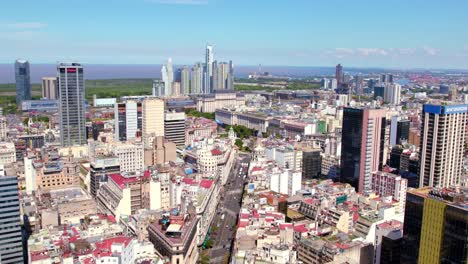 Dolly-in-aerial-view-of-downtown-Buenos-Aires,-contrast-between-old-period-buildings-and-new-taller-ones