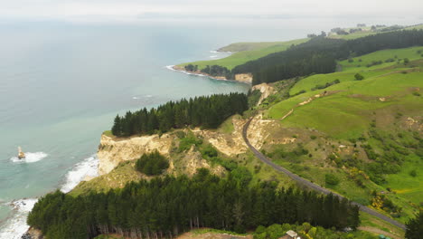 Seacliff-in-New-Zealand-island-south-side,-aerial-opening-clip