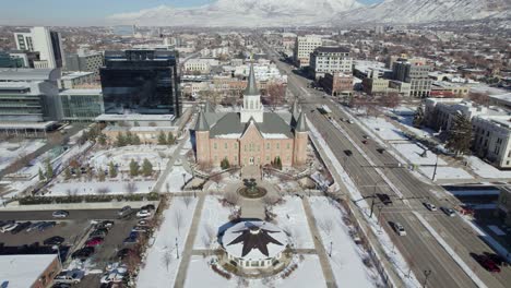 Provo-City-Center-LDS-Mormon-Temple,-Pullback-Reveal-of-Utah-County,-Aerial