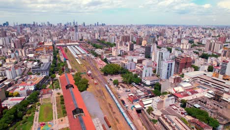 Aerial-view-of-the-train-tracks-in-the-middle-of-the-Almagro-neighborhood-in-the-city-of-Buenos-Aires,-sustainable-transport-in-the-capital-of-Argentina