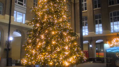 Decorated-Christmas-Tree-With-Bright-Lights-In-Hay's-Galleria,-Southwark,-London-Bridge-City,-UK