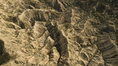 Sunlit-eroded-sandstone-hills-and-ravines-in-Vashlovani,-Georgia