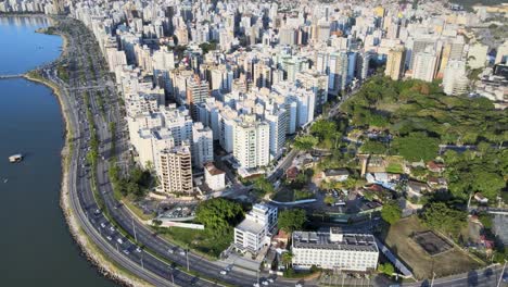 Aerial-drone-scene-at-high-altitude-of-the-center-of-Florianópolis-urban-center-big-capital-with-many-buildings-streets-and-Hercilio-Luz-bridge-urban-center-seen-from-above-capital-santa-catarina