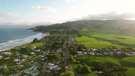 Aerial-panorama-of-tranquil-Karitane-Beach-and-town,-South-Island,-New-Zealand