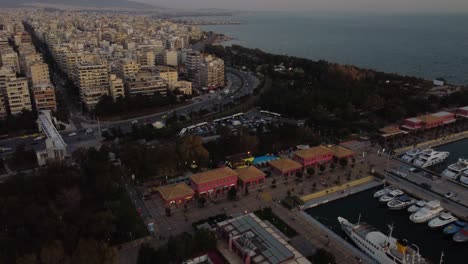 Aerial-View-of-Flisvos-Marina-and-Coastal-Traffic-in-Athens,-Greece-at-Twilight,-Drone-Shot