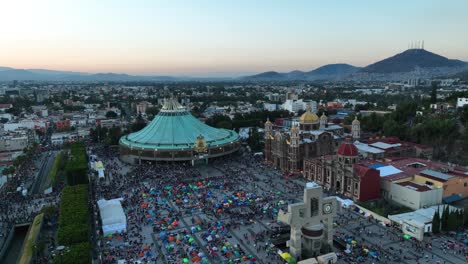 Aerial-view-around-Our-Lady-of-Guadalupe-pilgrims-spending-a-full-day-at-the-Shrine,-Patroness-of-the-Americas,-Mexico