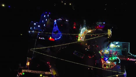 Aerial-Night-Time-View-Of-Christmas-Winter-Wonderland,-Bright-Colorful-Lights-In-Valencia-Neighborhood