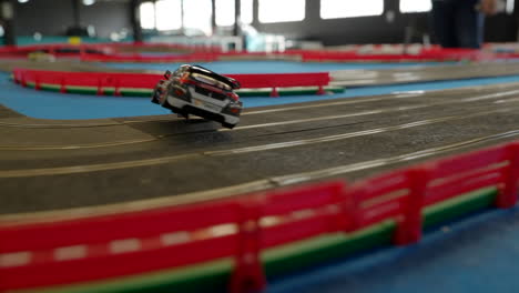 Model-BMW-Scalextric-racing-vehicle-lost-control-on-scale-running-track-at-Barcelona-car-show