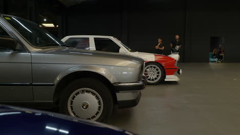 Custom-BMW-e30-rally-sports-car-leaving-Barcelona-classic-car-warehouse-fan-meeting
