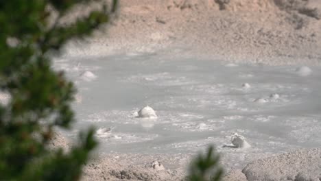 Slow-motion-pan-right-across-geothermal-hot-springs-at-Yellowstone-national-park
