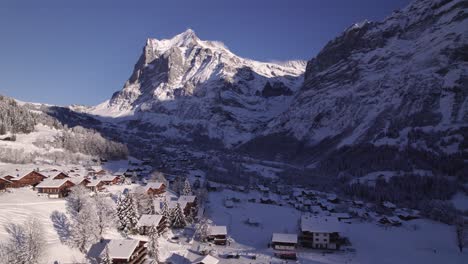 pushing-in-over-Bodmi-Area-in-snowy-mountain-paradise-Grindelwald-in-Swiss-Alps-with-picturesque-view-of-Mount-Wetterhorn