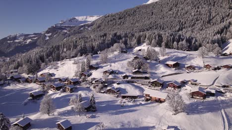 pushing-out-snowy-mountain-village-in-Grindelwald-Switzerland