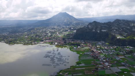 Panoramic-View-Of-Coastal-Rural-Landscape-With-Village-And-Farmlands-Near-Mount-Batur,-Bali-Indonesia