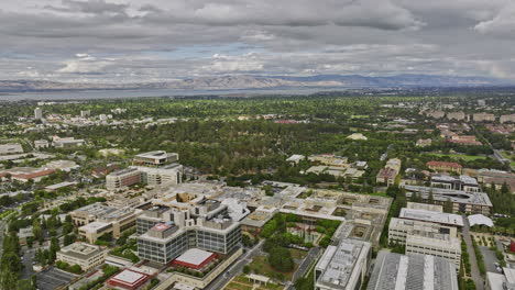 Stanford-City-California-Aerial-v11-flyover-building-complex-of-university-campus-hospital-department,-healthcare-medical-center-with-bay-views-in-the-background---Shot-with-Mavic-3-Cine---June-2022