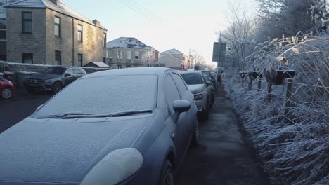 A-line-of-frozen-cars-on-a-quiet-street
