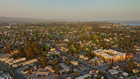 Santa-Cruz-California-Aerial-v14-panoramic-view-flyover-town-center-capturing-charming-neighborhood,-san-lorenzo-river-and-beach-boardwalk-at-sunset-golden-hour---Shot-with-Mavic-3-Cine---May-2022