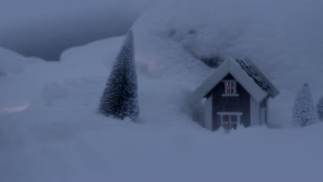 Miniature-home-of-Santa-Claus,-little-house-covered-in-snow-with-fir-tree