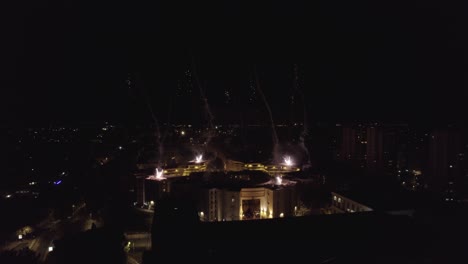 Aerial-shot-of-fireworks-on-top-of-a-roof-during-the-night-in-France