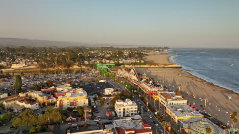 Santa-Cruz-California-Aerial-v8-flyover-beach-boardwalk-amusement-park-on-a-long-stretch-of-sandy-beach-with-san-lorenzo-river-meets-the-sea-at-sunset-in-summer---Shot-with-Mavic-3-Cine---May-2022