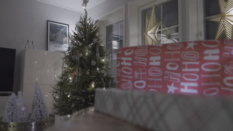 Close-up-of-gifts-with-Christmas-tree-on-the-back