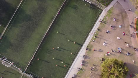 People-playing-on-small-soccer-football-training-fields
