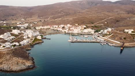 An-awe-inspiring-aerial-shot-of-approaching-Loutra-in-Kythnos-from-the-sea-during-sunrise