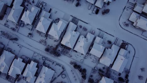 Spinning-clockwise-shot-of-the-winter-community-taken-from-drone