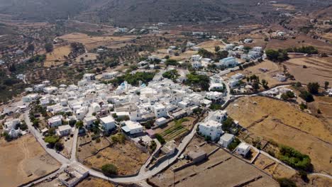 A-picturesque-aerial-shot-of-a-whitewashed-village-in-Paros,-Greece