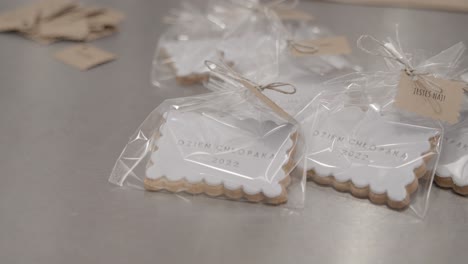 Handmade-butter-cookies-with-white-icing-and-custom-lettering-wrapped-in-cellophane-as-personalized-gift