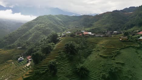 Amazing-aerial-footage-of-green-and-lush-mountains-in-an-high-altitude-exotic-village