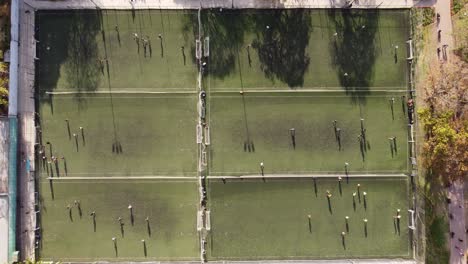 Six-soccer-football-training-fields-ina-a-row-and-players-practicing
