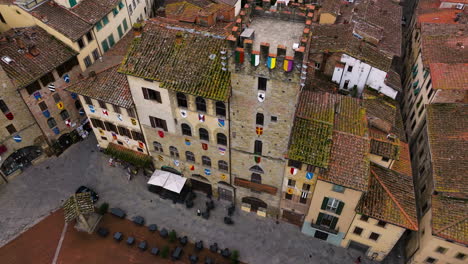 Medieval-Buildings-In-Arezzo,-Tuscany,-Italy---aerial-drone-shot