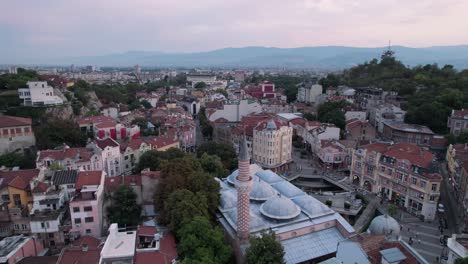 Aerial-drone-shot-of-Plovdiv-Old-town,-Bulgaria-[landmarks:-Roman-theatre-of-Philippopolis,-Djumaya-Mosque,-Clock-Tower-also-Plovdiv-Old-Town-is-a-UNESCO-World-Heritage-Site-filled-with-ancient-ruins