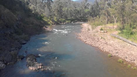 Aerial-shot-moving-forward-along-a-high-country-river-stream-in-Australias-high-country