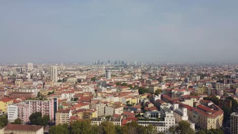 Endless-cityscape-of-Milan-city,-aerial-drone-ascend-view