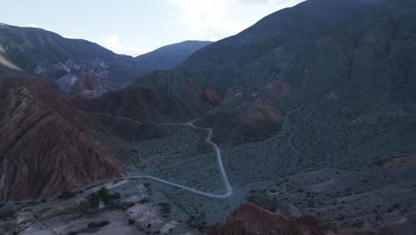 Purmamarca,-Jujuy,-Argentina,-Aerial-Drone-Above-Seven-Colors-Hills-and-Route-Between-Andean-Mountain-Range,-South-America