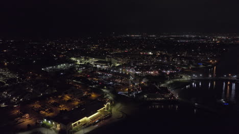 San-Diego-California-Aerial-v115-cinematic-drone-flyover-the-bay-towards-coronado-island-capturing-illuminated-cityscape-of-the-neighborhood-at-night---Shot-with-Mavic-3-Cine---September-2022
