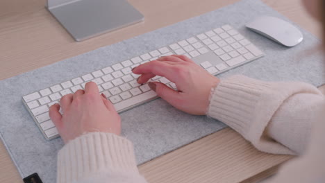 Remote-Work-Concept---Woman-Working-At-Home-Typing-On-A-Wireless-Keyboard