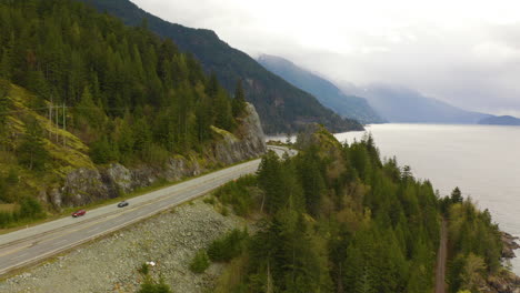 Cinematic-aerial-view-of-a-scenic-Pacific-coastal-highway-in-British-Columbia,-Canada