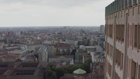 Milan-cityscape-and-side-of-Velasca-Tower,-aerial-drone-view