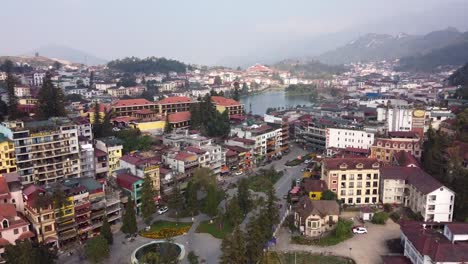 Aerial-view-of-Sapa-Cityscape,-tranquil-scenery-with-Sapa-lake-in-Background,-Vietnam