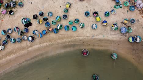 Topdown-view-of-Mui-Ne-Beach-with-colorful-Boats-from-fish-market-on-Sand-,-Binh-Thuan-Vietnam
