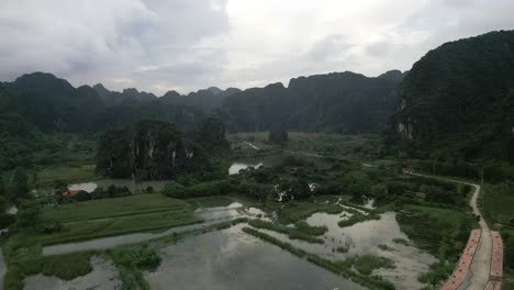 Aerial-of-wetland-valley-in-the-asian-green-lush-mountains-during-an-overcast-day