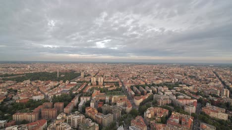Wide-view-of-Milan-cityscape,-tilt-down-reveal-shot
